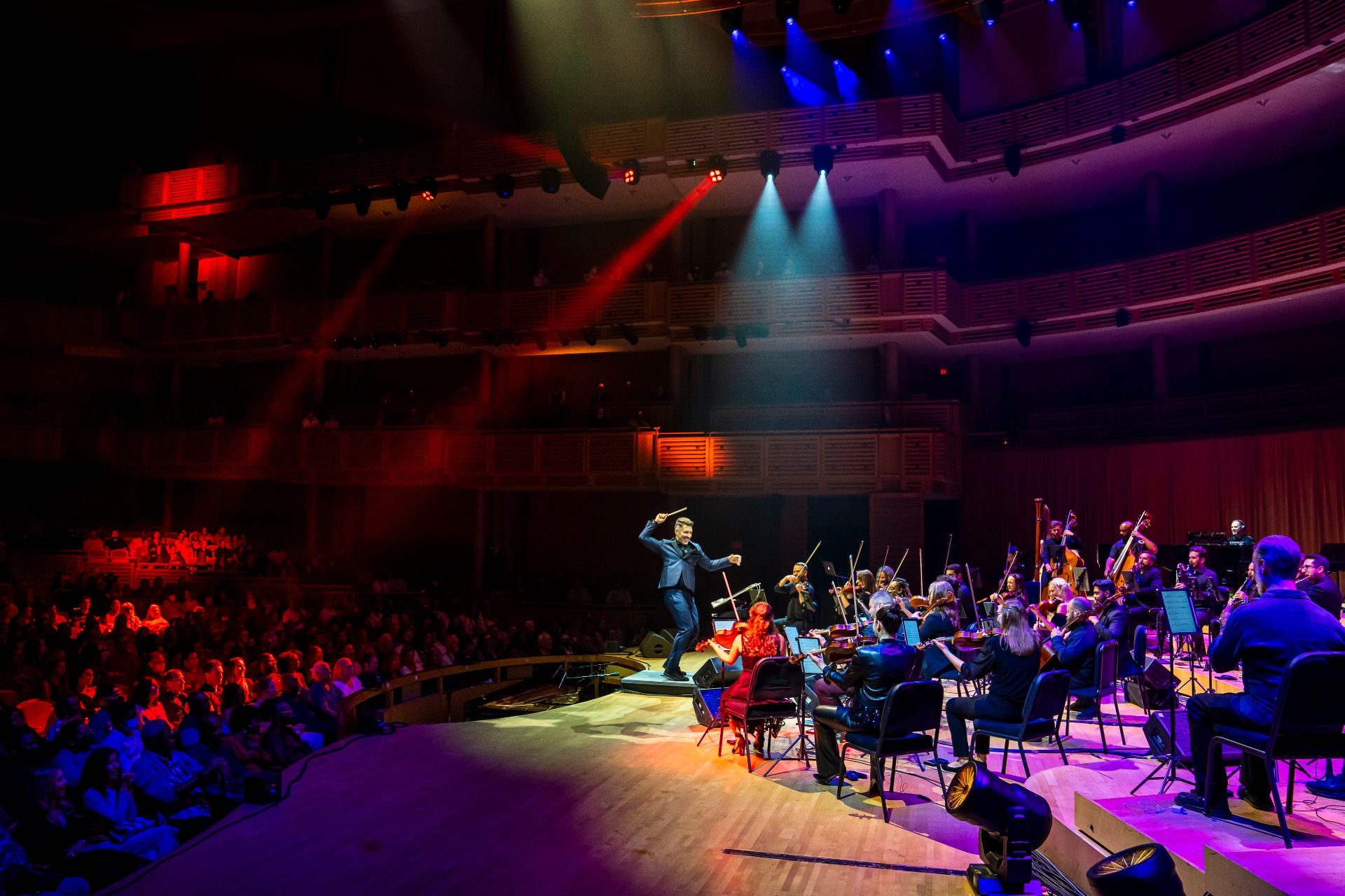 Nu Deco Ensemble conductor on stage at the Adrienne Arsht Center
